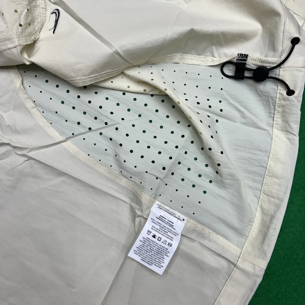 Nike tech button
